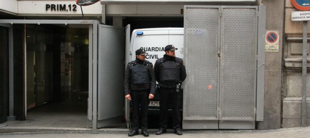 Spanish police and transport van in front of the Audiencia Nacional