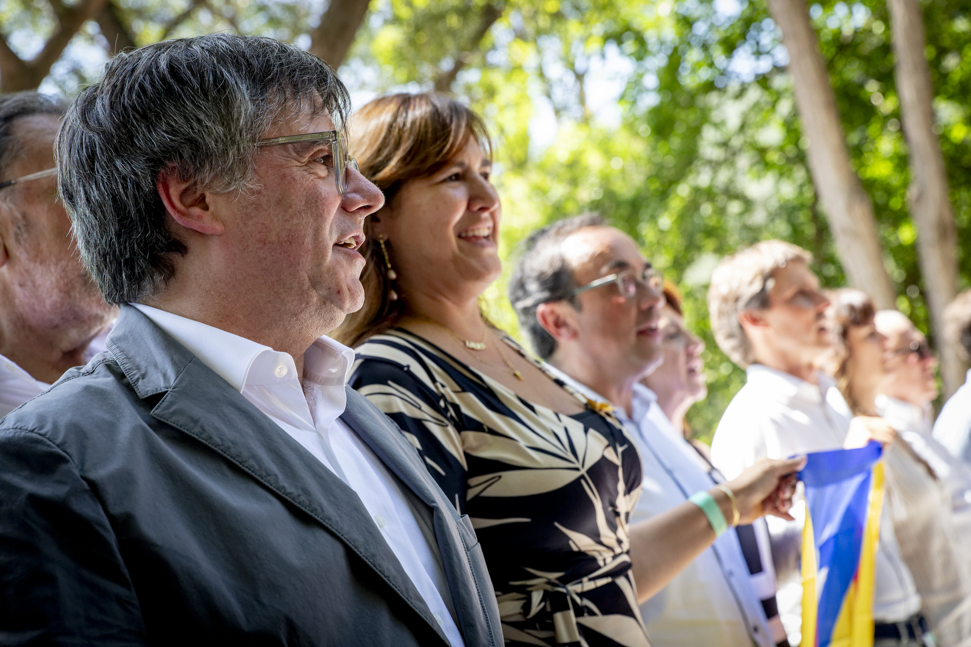 Carles Puigdemont, Laura Borràs i Josep Rull, en l'acte que Junts va fer a Els Banys i Palaldà el juliol passat (Fotografia: Albert Salamé)